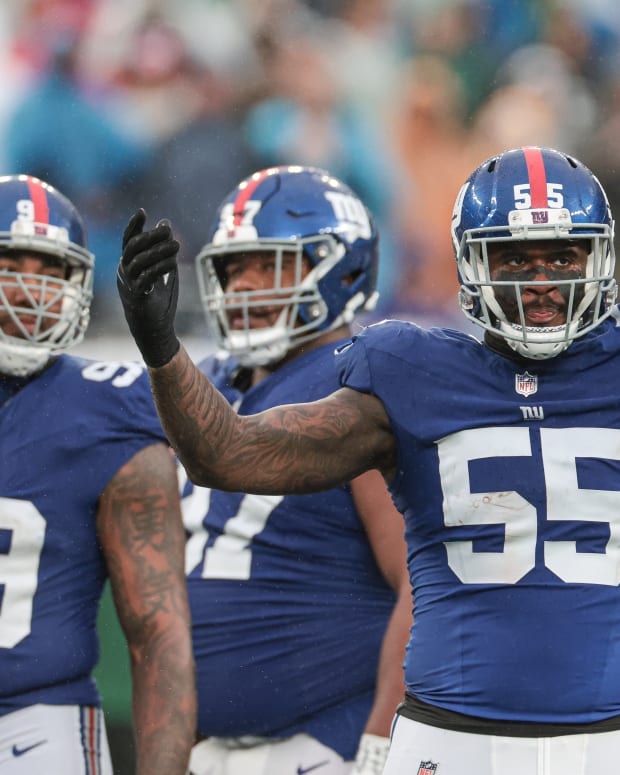 Oct 29, 2023; East Rutherford, New Jersey, USA; New York Giants linebacker Jihad Ward (55) gestures to fans during the second half against the New York Jets at MetLife Stadium.